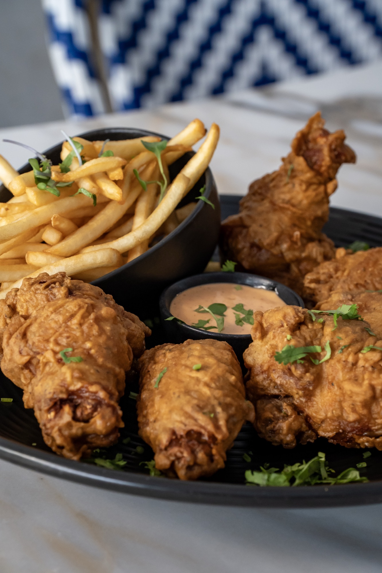 Golden fried fish with masala fries and house aioli